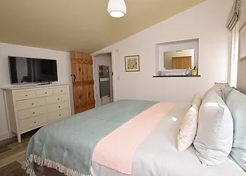 King-size bedroom through to en-suite shower room