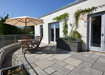 Private courtyard area with hot tub and seating