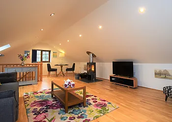 Beautifully finished lounge/dining area with cosy woodburner