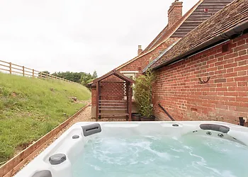Tucked away, the hot tub offers ultimate seclusion