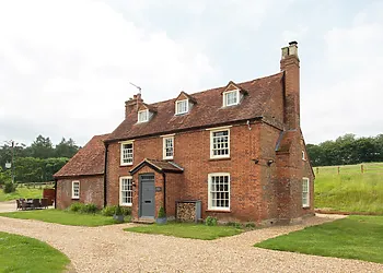 A grand detached farmhouse, perfect for family gatherings