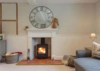 On cooler evenings, light the woodburner and enjoy the warmth