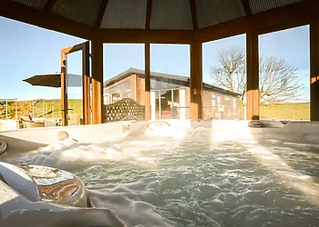 Relax and enjoy a dip in the private luxury housed hot tub