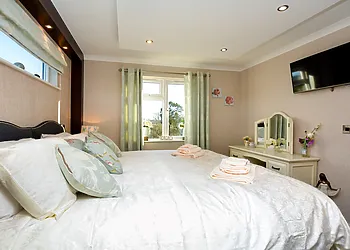 Relax in the comfy master bedroom and perhaps watch some TV