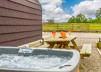 Enjoy a dip in your private hot tub ( available at an additional charge )