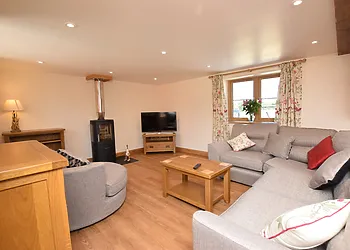 Stylish lounge area with woodburner