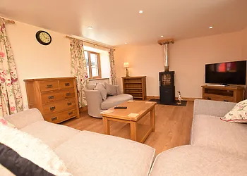 Stylish lounge area with woodburner