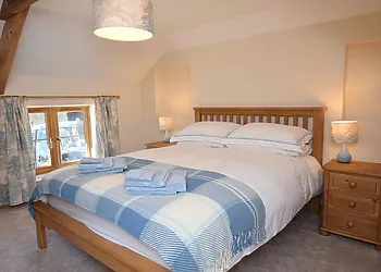 King-size bedroom with en-suite shower room