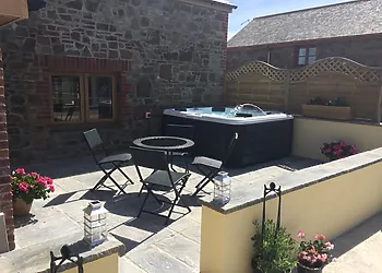 Enclosed private patio with hot tub