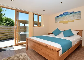 Double bedroom with direct access to the private hot tub