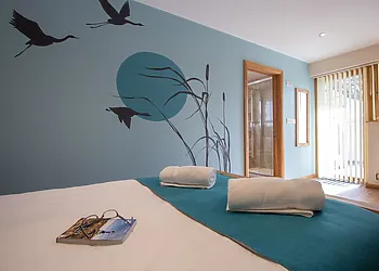 Double bedroom with access to patio area, hot tub and seating