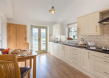 A beautiful kitchen with adjoining utility room