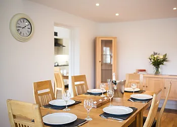 The dining area leads through to the kitchen