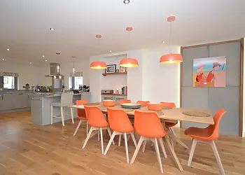 The kitchen leading onto the dining area giving a friendly ambience