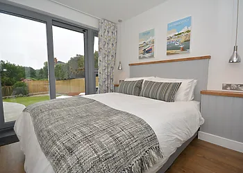 King-size bedroom with access to garden and great views