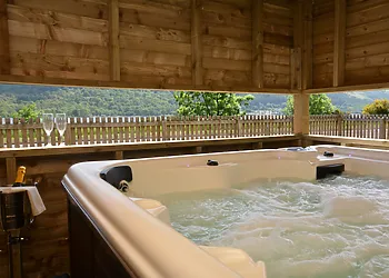 Enjoy a dip in the housed hot tub with viewing gallery to admire the views
