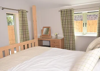Beautiful master bedroom with four-poster bed and dressing table