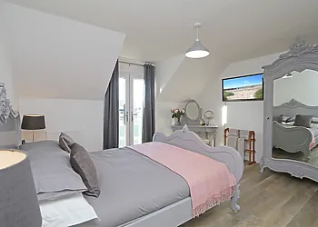 Spacious master bedroom with TV and ensuite