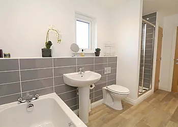 Bathroom with bath and separate shower