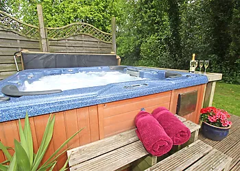Enjoy some time together in the hot tub, located in the owner