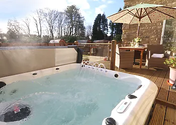 View of the hot tub and outdoor dining area