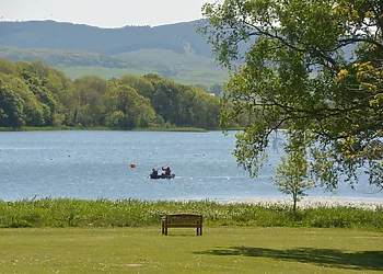 Watch the rowing boats go by from the balcony