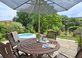 Beautiful enclosed garden with lay-z-spa hot tub, seating and BBQ