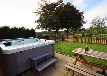 Enjoy the countryside views from the hot tub
