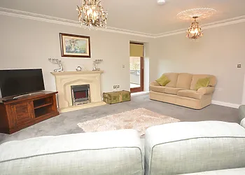 Comfy sofas surround the TV 