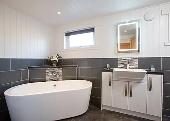 Take a relaxing soak in the deep bath tub