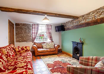 Spacious lounge with feature fireplace and SMART TV