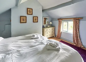 A cosy twin room with orchard views