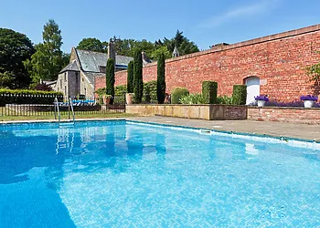 Enjoy lazy days by the outdoor heated pool