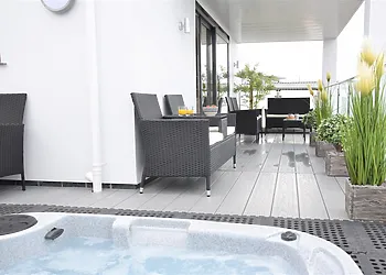 Balcony seating area with hot tub