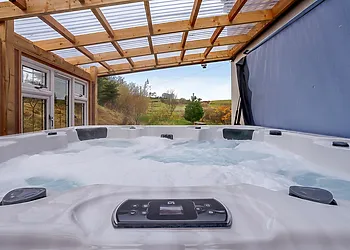 Relax in your own private hot tub and admire the gorgeous views
