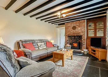 Welcoming lounge with comfy sofas and exposed beams
