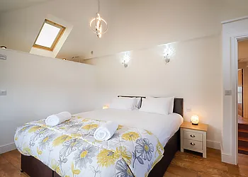 Master bedroom with super-king-size bed with an open plan en-suite