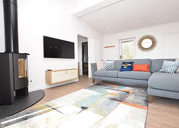 Relax and watch a great movie or enjoy cosy nights in front of the lovely wood burner