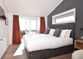 Wonderful super king-size bedroom that can be made into a twin on request with Smart TV, en-suite shower room and patio doors