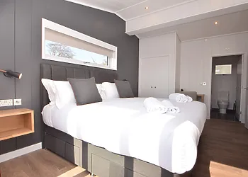 Step inside the stylish bedroom from the patio doors