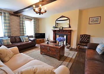 Beautiful lounge with open fireplace and exposed stone