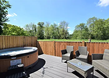 The private and enclosed decking with hot tub