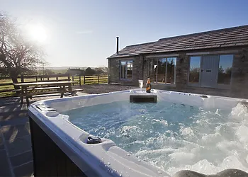 Sit in the hot tub and enjoy the fabulous views
