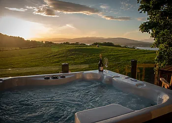 Relax in the private hot tub and admire the views