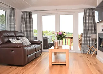 French doors lead to the balcony with hot tub and seating area