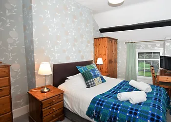 Double bedroom with study area and TV