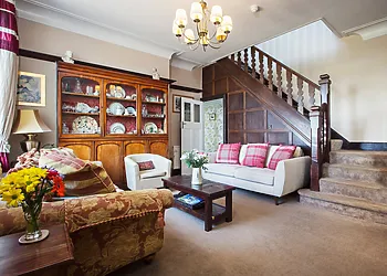 Spacious hallway leading to the ground floor family wing