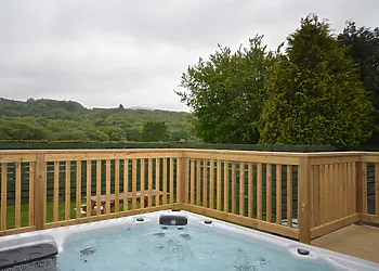 Enjoy the private hot tub during your stay