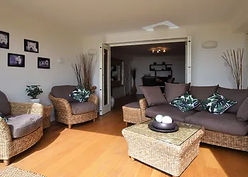 Bi-folding doors open from the sun room