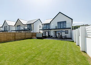 View towards the back of the property with private hot tub and seating